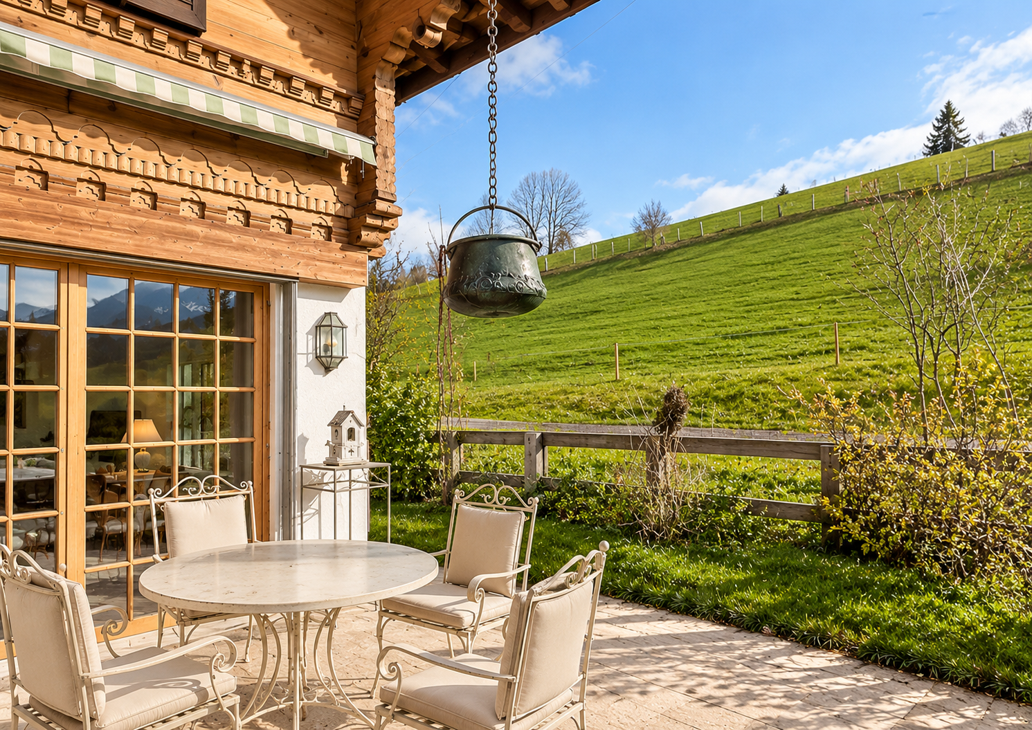 South-facing terrace with open meadow views — family chalet near Gstaad