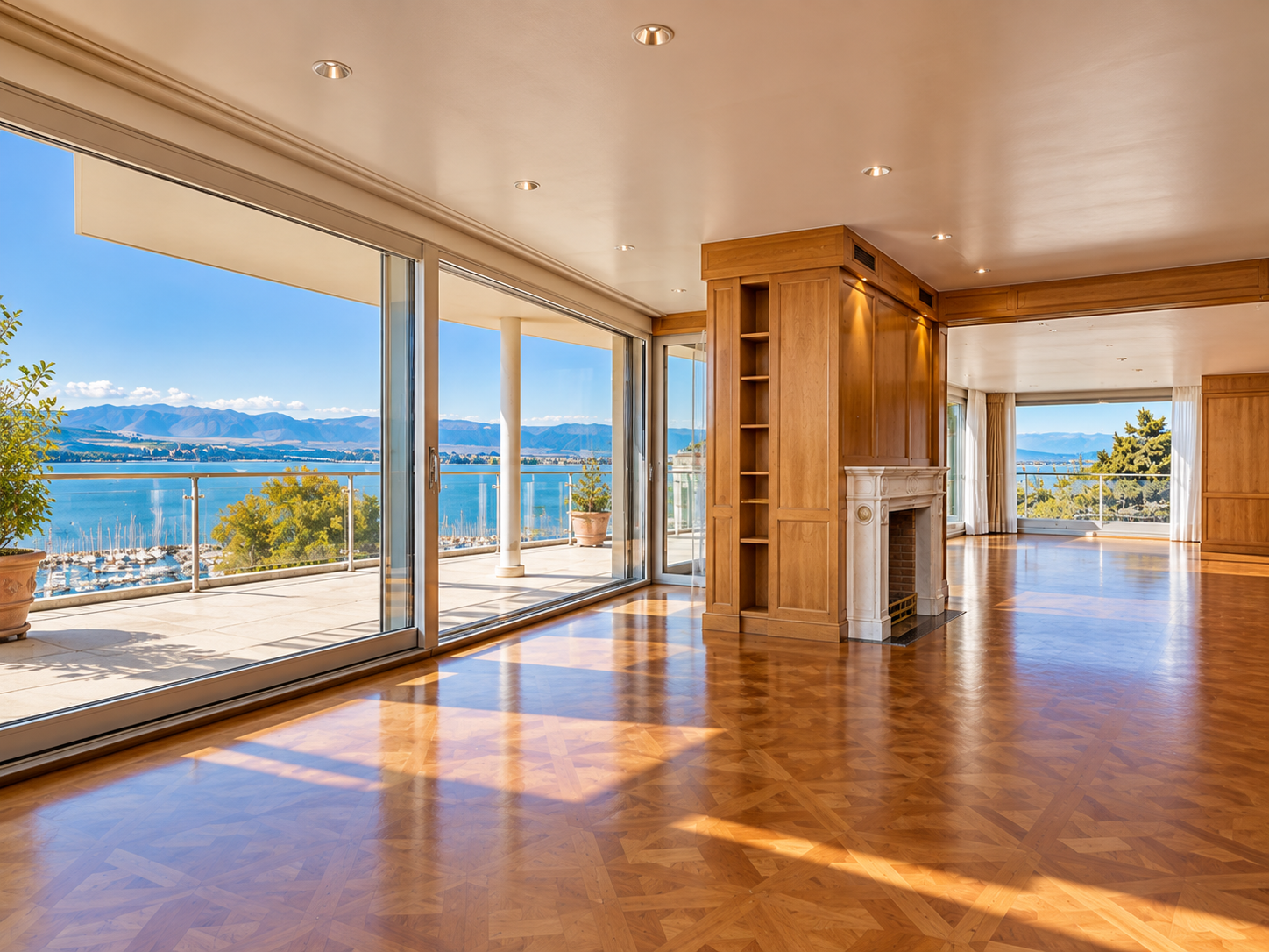 Geneva duplex penthouse — grand reception room with fireplace and panoramic Lake Geneva views