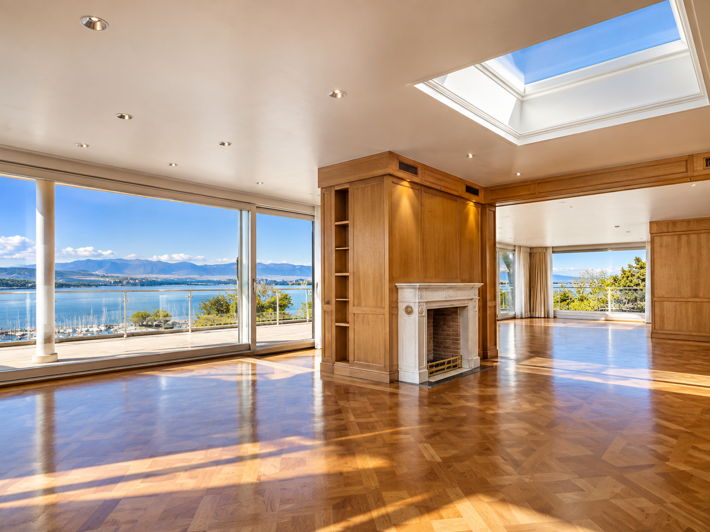 Geneva duplex penthouse — reception room with skylight and lake views