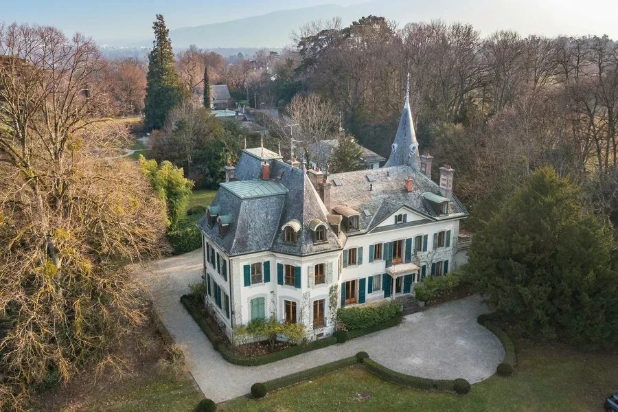Historic Geneva estate Choulex — aerial view showing the château roofline and private parkland
