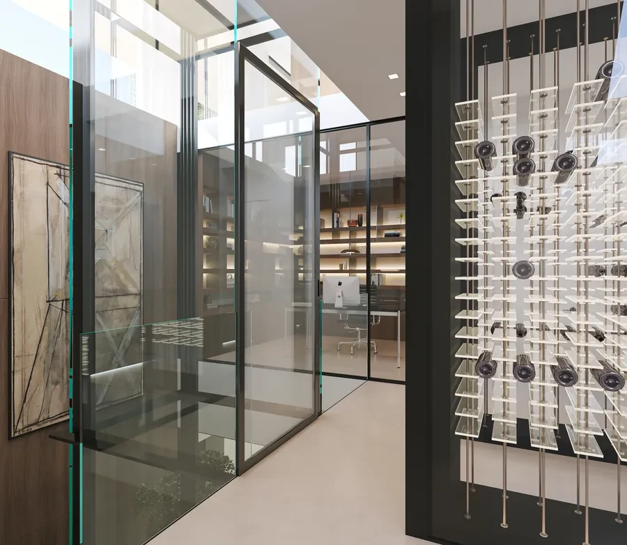 Cologny Geneva new-build villa — interior hallway with glass wine display wall and library office beyond glass partitions
