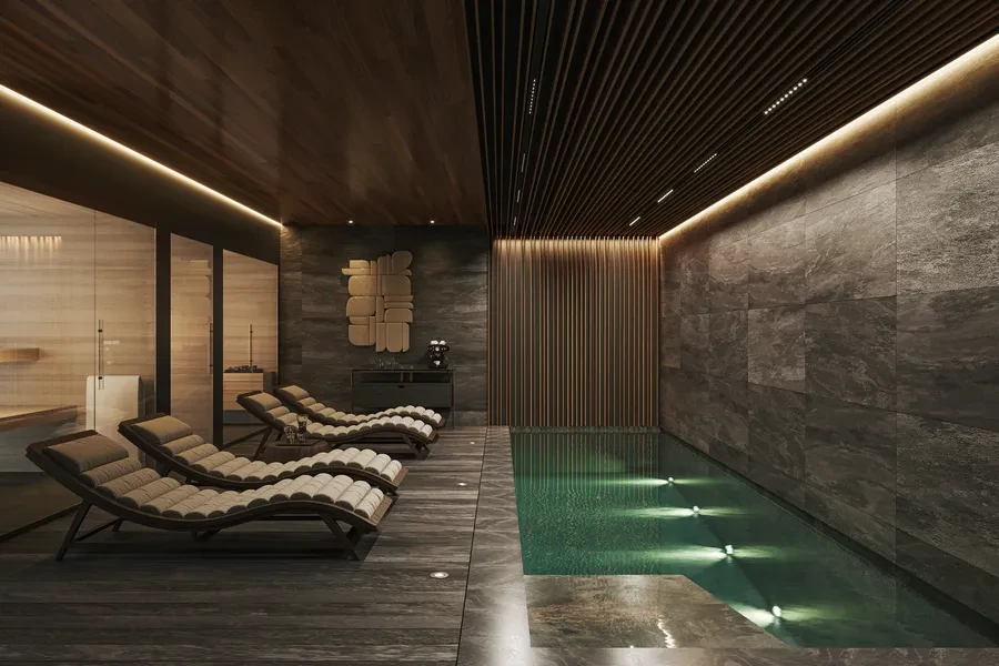 Cologny Geneva new-build villa — indoor spa pool with dark stone walls, wood-slat ceiling and lounge chairs