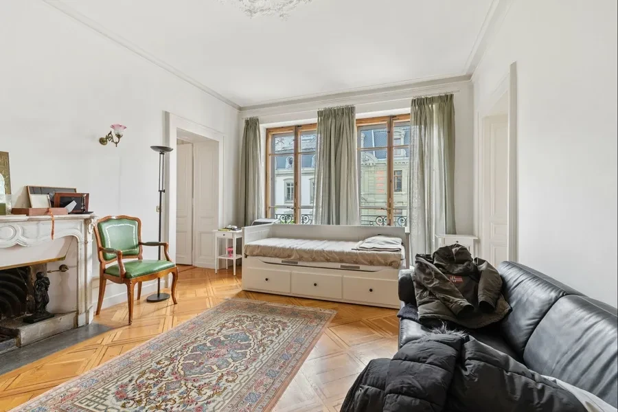 Geneva 19th-century townhouse — bedroom with original marble fireplace, parquet floors and period mouldings