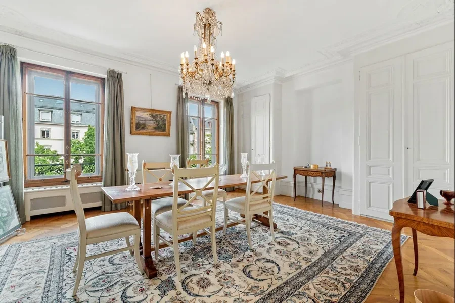 Geneva 19th-century townhouse — formal dining room with crystal chandelier and period architectural detail