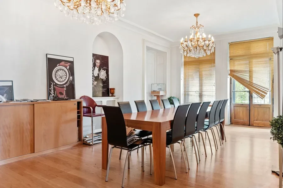 Geneva 19th-century townhouse — large dining room with twin crystal chandeliers and generous proportions