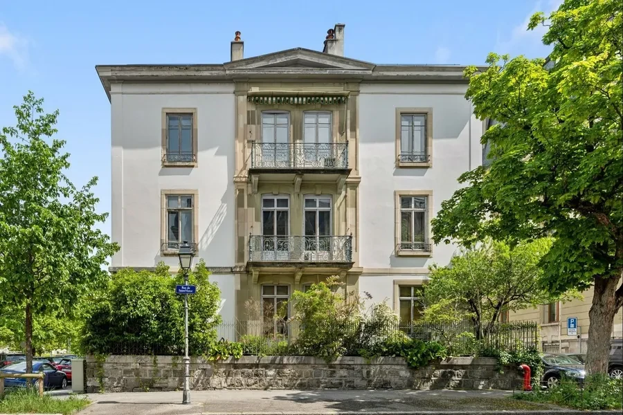 Geneva Russian Church district — 19th-century townhouse elegant neoclassical facade with wrought-iron balconies
