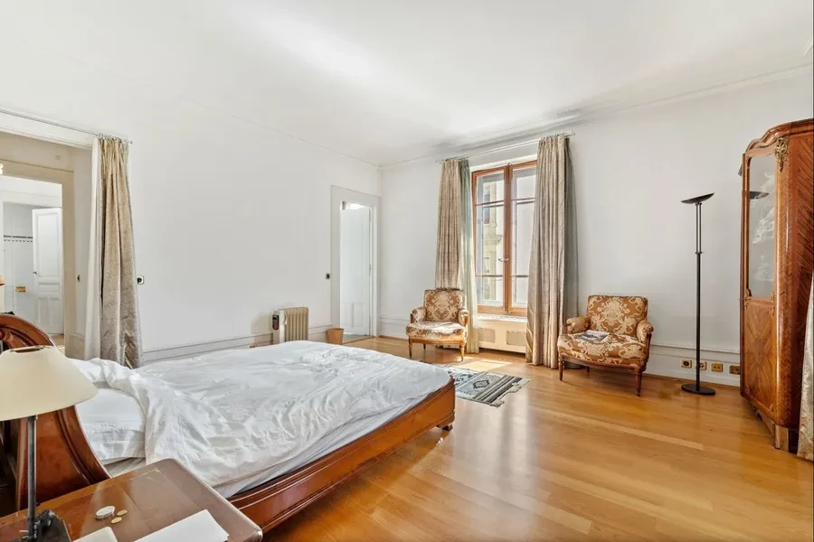 Geneva 19th-century townhouse — principal bedroom with parquet floors, tall windows and period character