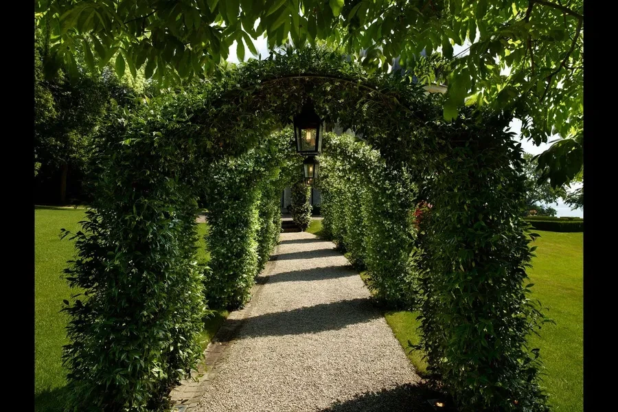 Garden archway pergola path with lanterns