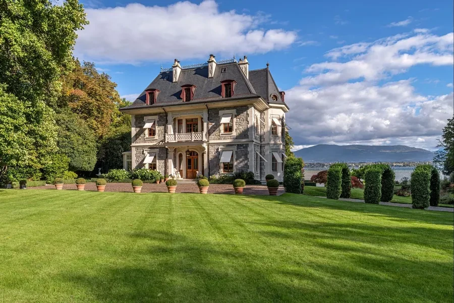 Classical manor facade with manicured lawn
