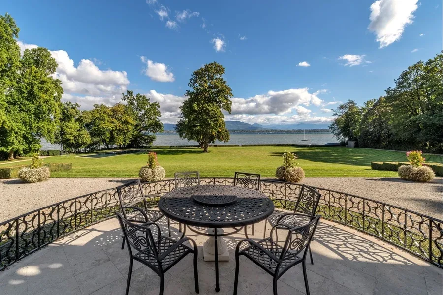 Lakeside terrace with iron table and chairs