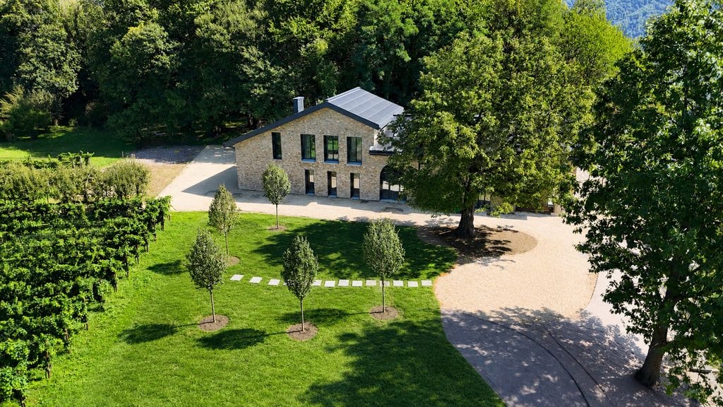 Aerial view of villa exterior and landscaped grounds, Porza