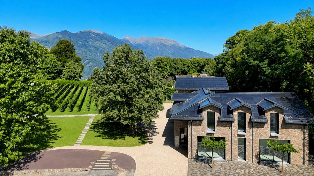 Villa exterior with solar panels and vineyard, Porza