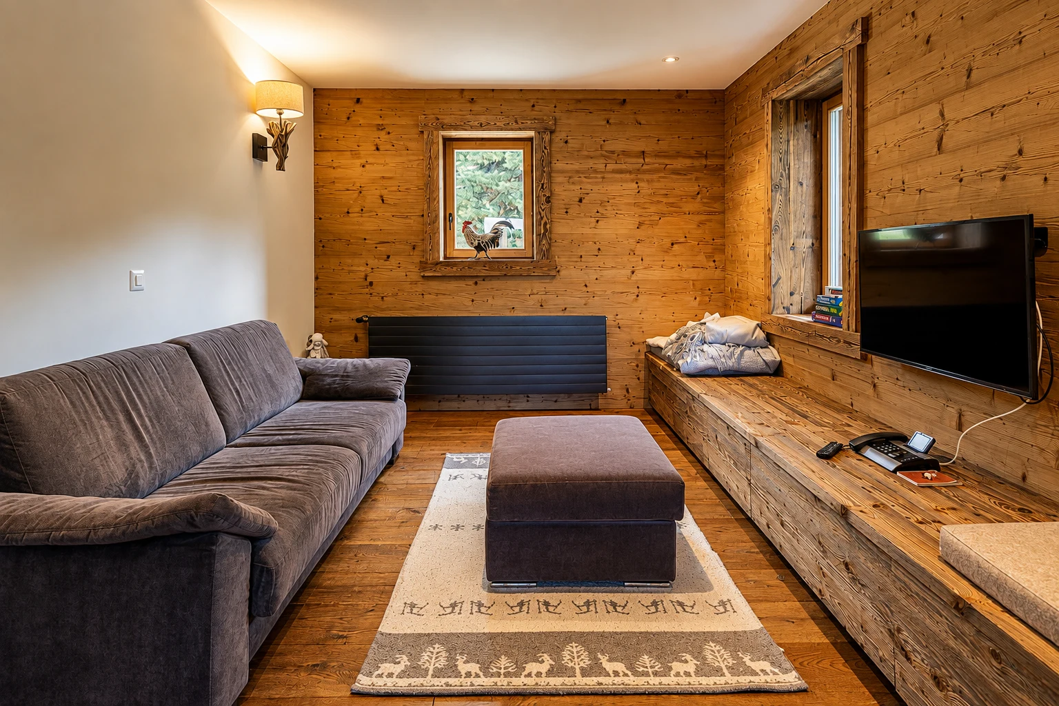 Cuisine moderne avec armoires en bois dans un chalet alpin de luxe en Suisse