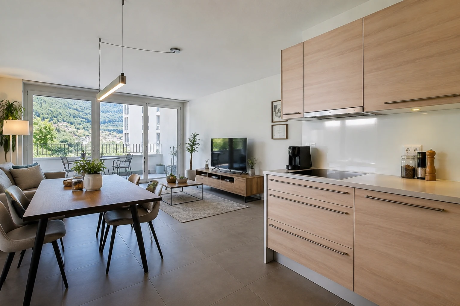 Séjour et cuisine en open space lumineux dans un appartement moderne à vendre à Montreux