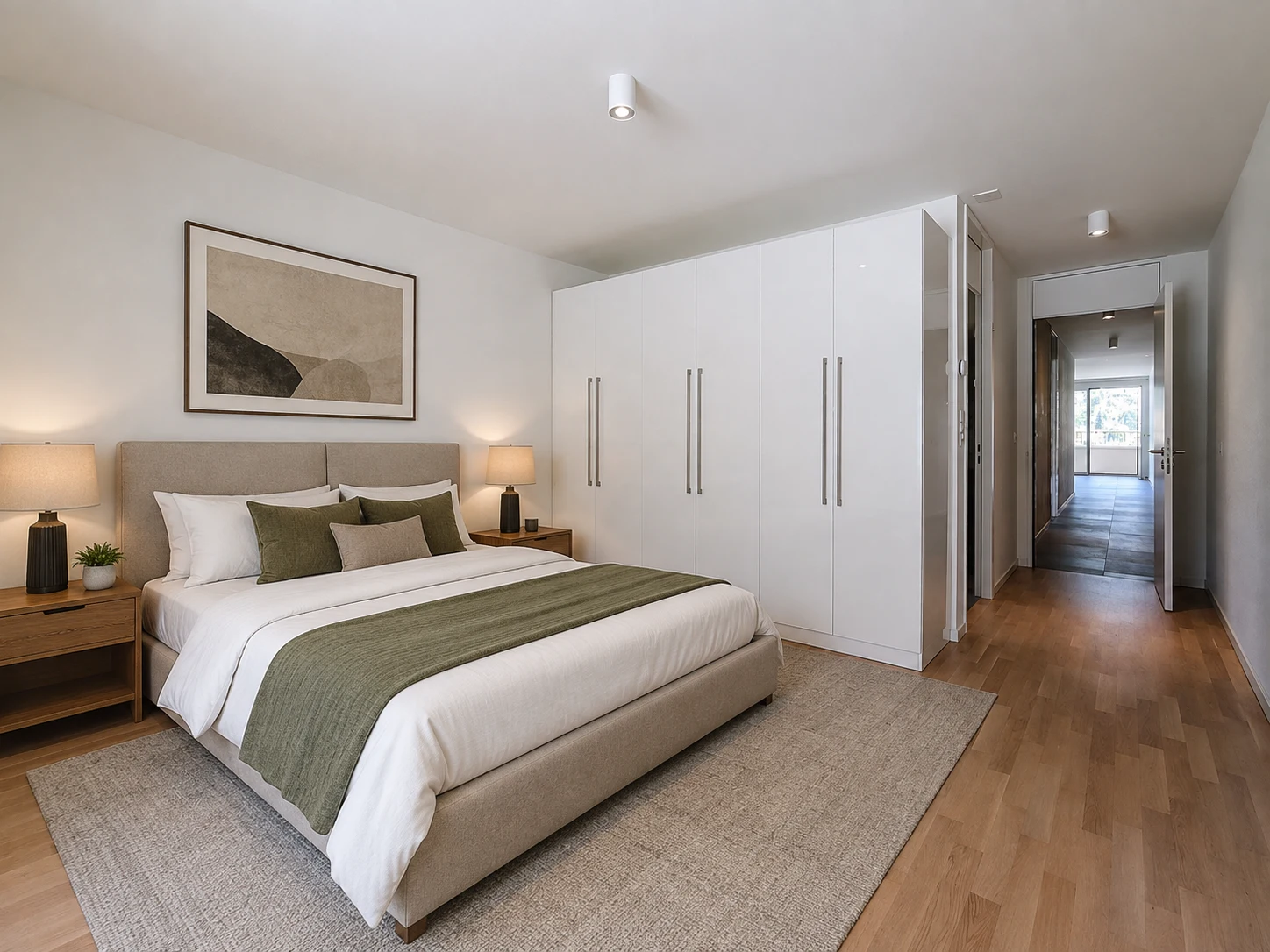 Chambre lumineuse avec armoires intégrées dans un appartement moderne à Montreux